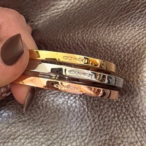 Coach Gold, Silver, and Bronze Bangles